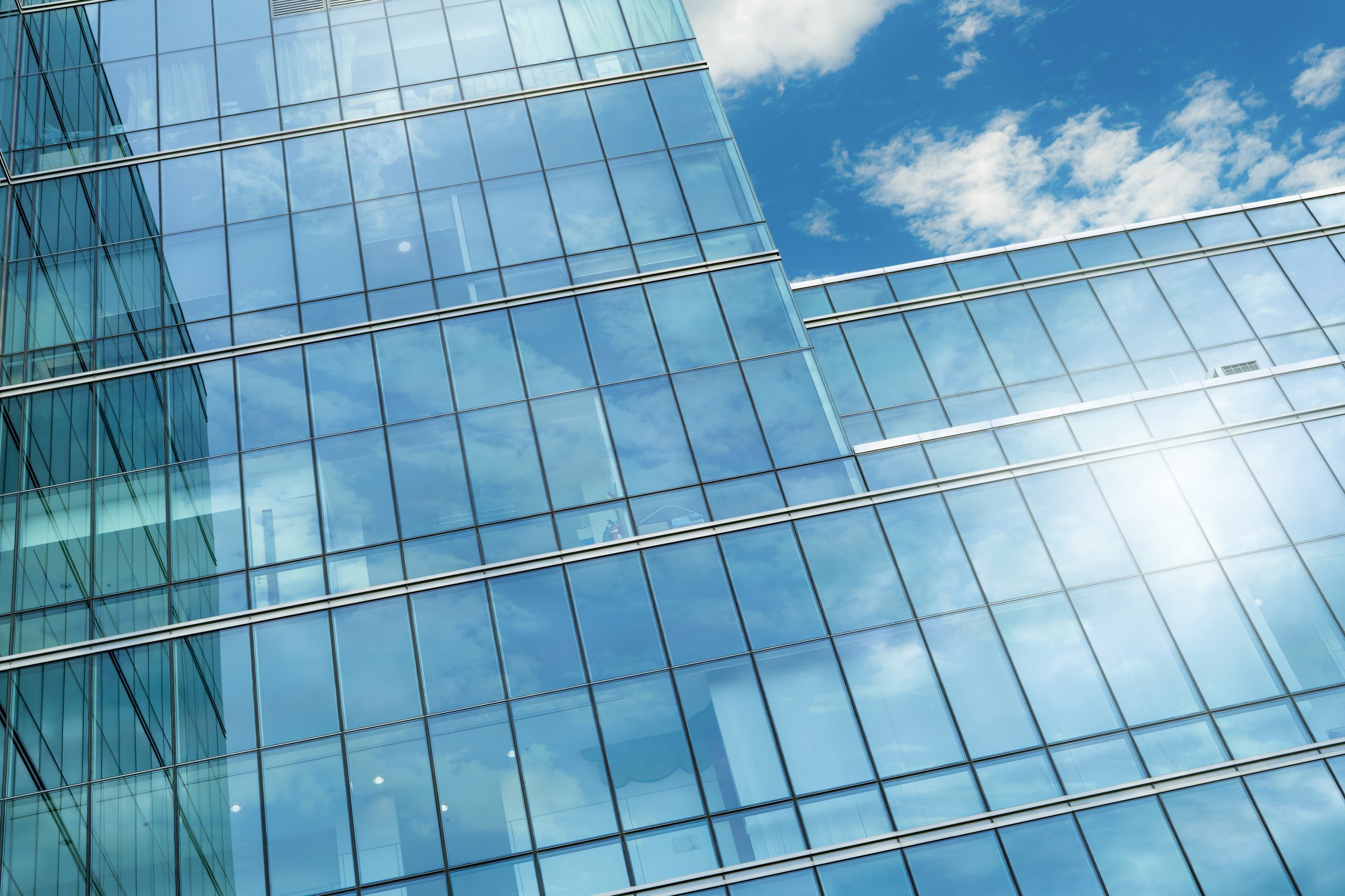 Modern sustainable glass office building. Exterior view of corpo